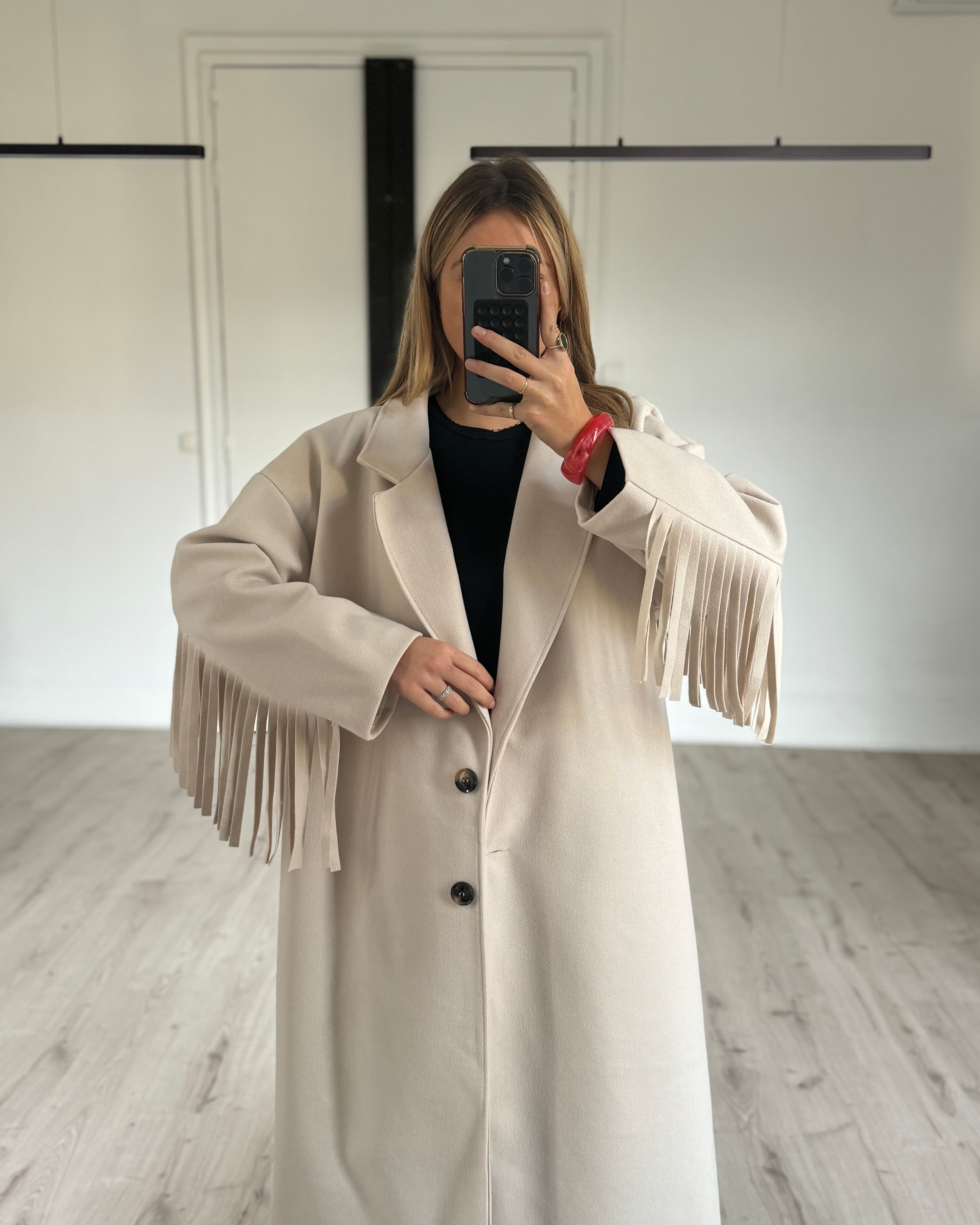 Manteau à franges